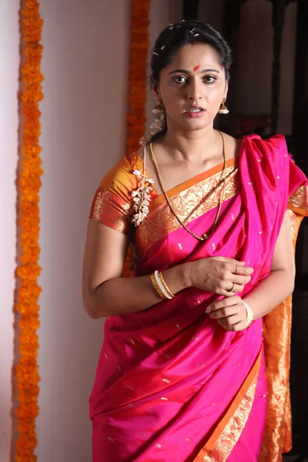 ANUSHKA SHETTY LONG HAIR IN TRADITIONAL RED SAREE